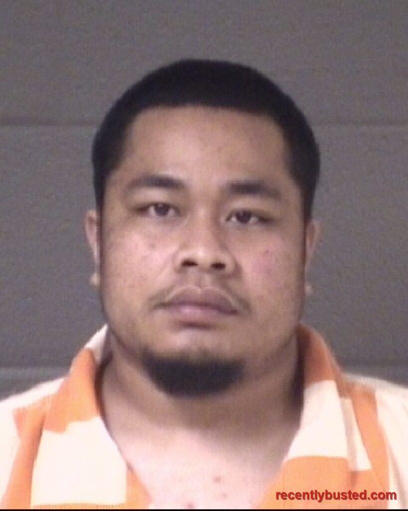 Booking photo of JUSTIN JOHN